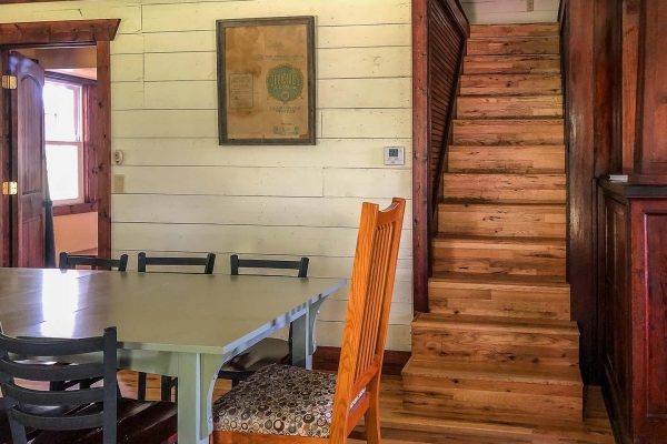 Dining and stairs to second floor — Piney River Farmhouse