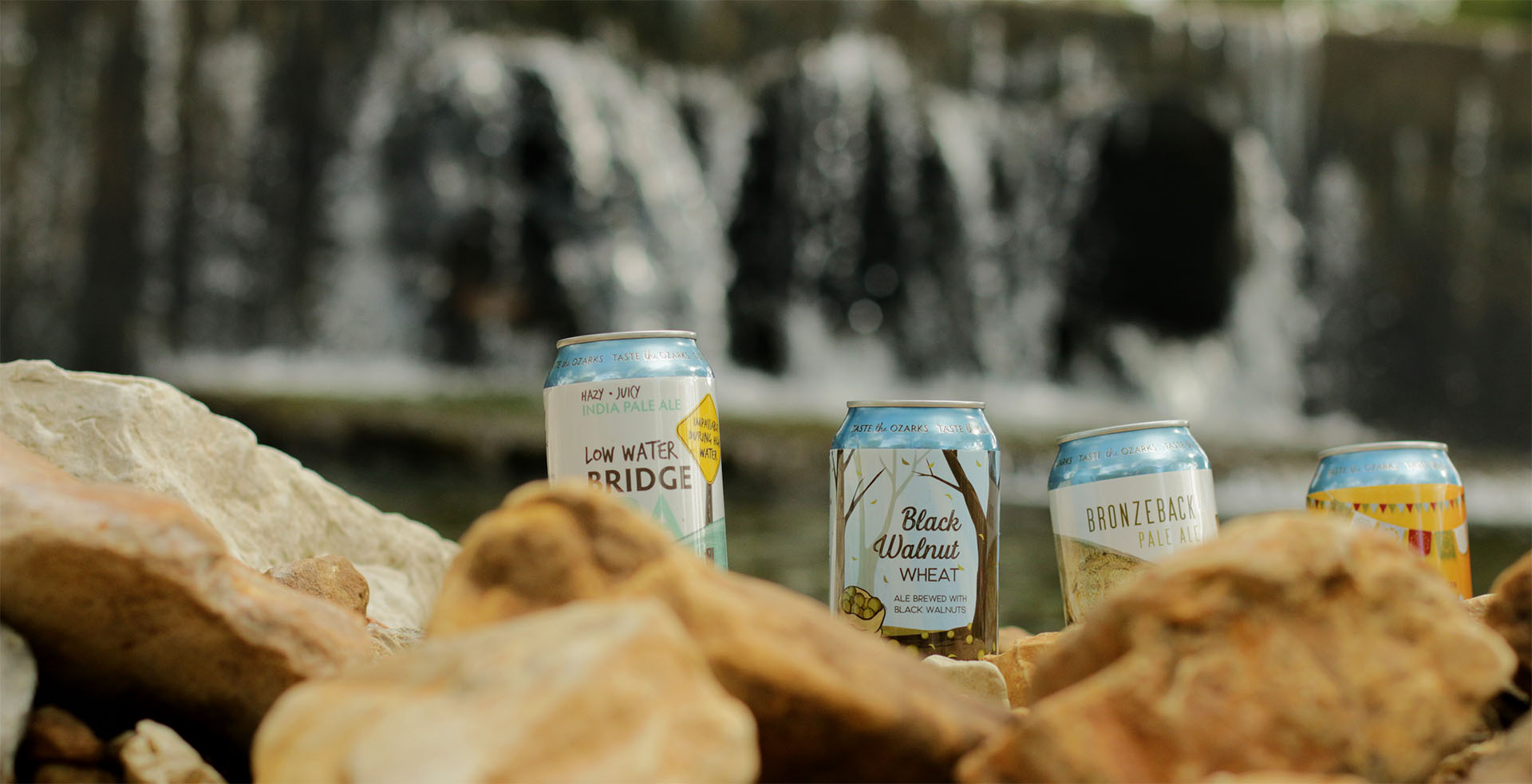Piney River Brewing Co. flagship beers in outdoor waterfall environment, June 2026.